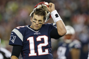 New England Patriots quarterback Tom Brady (12) takes off his helmet after failing to score on the last play of possession during the fourth quarter against the Seattle Seahawks at Gillette Stadium. The Seattle Seahawks won 31-24.  <br/>Mandatory Credit: Greg M. Cooper-USA TODAY Sports