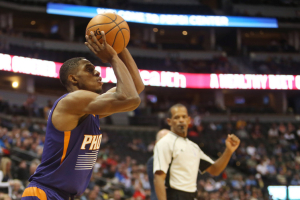 Phoenix Suns guard Brandon Knight (11) shoots the ball during the first half against the Denver Nuggets at Pepsi Center.  <br/>Mandatory Credit: Chris Humphreys-USA TODAY Sports