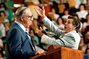 Cliff Barrows and George Beverly Shea singing “How Great Thou Art” during the 1980 Indianapolis, Indiana, Billy Graham Crusade. <br/>