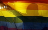 Gay Rights Activist Holding LGBT Flag