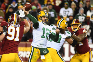 Green Bay Packers quarterback Aaron Rodgers (12) attempts a pass against the Washington Redskins during the second half at FedEx Field.  <br/>Mandatory Credit: Brad Mills-USA TODAY Sports