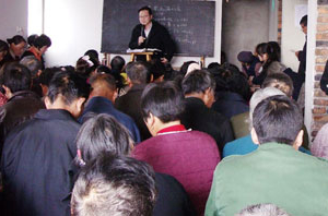 In this file photo, Rev. John Edward Hao is delivering sermons at an annual house churches leader's Bible-study conference held days ago in northern China. <br/>
