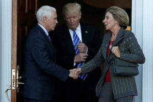 President-elect Donald Trump, center, and Vice President-elect Mike Pence, left, emerge with Betsy DeVos after their meeting at the main clubhouse at Trump National Golf Club in Bedminster, New Jersey, on Nov. 19, 2016. Photo by Mike Segar/Reuters <br/>