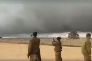 Israeli soldiers take videos of the amazing pillar of cloud that formed at the Syrian border. <br/>Facebook