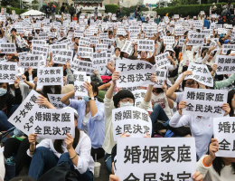 Tens of thousands of protesters in Taiwan rally against the government's passing of the Same-Sex Marriage Equality Bill. Protesters hold signs that stated that family marriage is decided by the people.  <br/>Facebook/EFCGA 