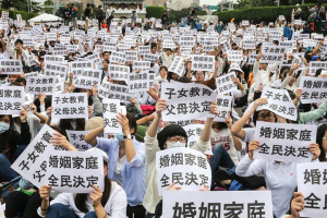 Tens of thousands of protesters in Taiwan rally against the government's passing of the Same-Sex Marriage Equality Bill. Protesters hold signs that stated that family marriage is decided by the people.  <br/>Facebook/EFCGA 