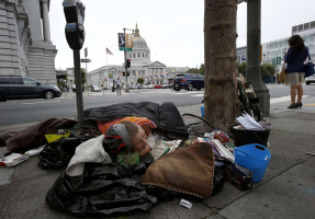 A homeless woman who calls herself “U” camps within sight of San Francisco City Hall. <br />
 <br/>Photo: Brant Ward / The Chronicle