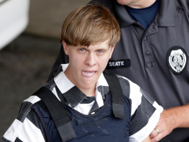 hooting suspect Dylann Roof is escorted from the Cleveland County Courthouse in Shelby, North Carolina, June 18, 2015. <br/>AP Photo