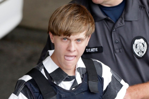 hooting suspect Dylann Roof is escorted from the Cleveland County Courthouse in Shelby, North Carolina, June 18, 2015. <br/>AP Photo