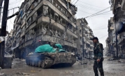 Syrian pro-government forces moved through the Jisr al-Haj neighborhood on Wednesday.