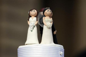 Two bride figurines adorn the top of a wedding cake during an illegal same-sex wedding ceremony in central Melbourne.<br />
<br />
 <br/>Reuters/Mick Tsikas 