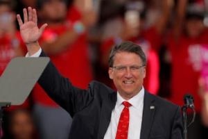 North Carolina Governor Pat McCrory waves before speaking ahead of Republican presidential nominee Donald Trump at a campaign rally in Raleigh,North Carolina.<br />
<br />
 <br/>Reuters/Chris Keane