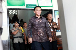 Jakarta's governor Basuki Tjahaja Purnama walks outside the court room shortly after his trial at the North Jakarta District Court. December 27, 2016 01:35am EST<br />
<br />
 <br/>Reuters 