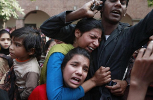 Women from the Christian community mourn for a relative, who was one of the victims killed by a suicide attack on a church, during his funeral in Lahore, March 17, 2015. Suicide bombings outside two churches in Lahore killed 14 people and wounded nearly 80 others during services on Sunday in attacks claimed by a faction of the Pakistani Taliban.  <br/>Reuters/Mohsin Raza