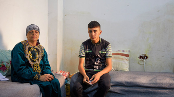 Jandark Behnam Mansour Nassi, widow with her 16-year-old son, Ismail – internally displaced people (IDPs) from Bartella, one of the Christian villages in the Nineveh Plains now supported by ACN in Erbil, northern Iraq  <br/>Aid to the Church in Need