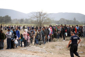Migrants line-up at a registration point after crossing the Macedonian-Greek border near Gevgelija, Macedonia, September 7, 2015.<br />
<br />
 <br/>Reuters/Stoyan Nenov