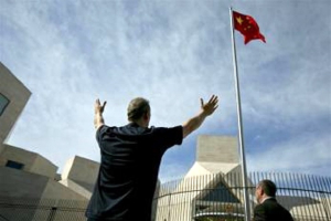 A member of the Christian Defense Coalition raises his hands during a prayer vigil outside the Chinese embassy in Washington, D.C. April 30, 2012 08:15am EDT <br/>Reuters