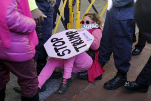 A Code Pink activist breaks a police line during an anti-Trump rally outside during the American-Israeli Public Affairs Committee (AIPAC) Conference at the Verizon Center in Washington March 21, 2016. <br />
<br />
 <br/>Reuters 