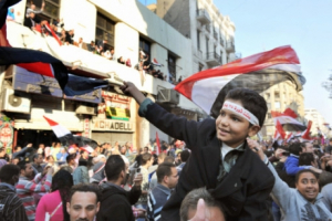 Egyptians hit the streets to celebrate President Hosni Mubarak's resignation in Cairo on Feb. 12, 2011. <br/>AP