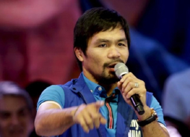 Filipino boxer Manny Pacquiao, who is running for Senator in the May 2016 vice-presidential election, speaks to supporters during the start of national elections campaigning in Mandaluyong city, Metro Manila February 9, 2016. <br />
<br />
 <br/>Reuters/Janis Alano