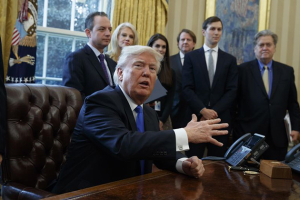 President Donald Trump talks with reporters in the Oval Office of the White House in Washington, Tuesday, Jan. 24, 2017, before signing an executive order on the Keystone XL pipeline. <br/>AP Photo/Evan Vucci