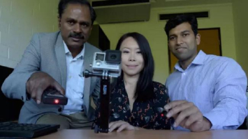 Professor Marimuthu Palaniswami, Associate Professor Elaine Wong and Dr Aravinda Sridhara Rao pose with a prototype of the camera and lasers which are the forerunners of the intended, final device. <br/>Paul Burston/University of Melbourne