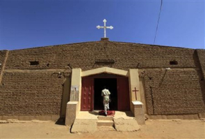 At least 25 Christian churches in Khartoum state in Sudan are in danger of being demolished because they were “trespassing into residential areas.” A South Sudanese worshipper arrives to attend Sunday prayers in Baraka Parish church at Hajj Yusuf, on the outskirts of Khartoum, February 10, 2013.  <br/>Reuters/Mohamed Nureldin Abdallah