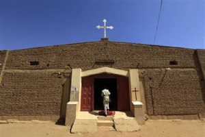 At least 25 Christian churches in Khartoum state in Sudan are in danger of being demolished because they were “trespassing into residential areas.” A South Sudanese worshipper arrives to attend Sunday prayers in Baraka Parish church at Hajj Yusuf, on the outskirts of Khartoum, February 10, 2013.  <br/>Reuters/Mohamed Nureldin Abdallah