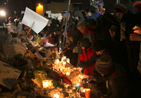 People leave candles and flowers across from the Quebec Islamic Cultural Centre on January 30, 2017.  <br/> Christinne Muschi / Reuters