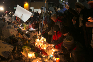 People leave candles and flowers across from the Quebec Islamic Cultural Centre on January 30, 2017.  <br/> Christinne Muschi / Reuters