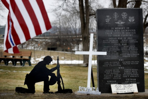 After a cross was removed from a kneeling soldier at the veterans memorial park in Belle Plaine, MN, advocates for the cross placed new ones at the park and guarded them throughout the day.  <br/>AP Photo