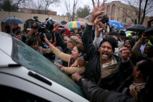 Supporters of Pakistan's government minister for religious minorities Shahbaz Bhatti chant slogans in front of an ambulance transporting his body toward the morgue at a local hospital in Islamabad, Pakistan, Wednesday, March 2, 2011. Gunmen shot and killed Bhatti, the latest attack on a high-profile Pakistani figure threatened by Islamist militants for urging reform of harsh blasphemy laws that impose the death penalty for insulting Islam. <br/>AP Images / Irfan Haider