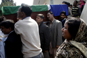 People carry the coffin of slain Christian leader Shahbaz Bhatti from a local church after a funeral ceremony in Islamabad, Pakistan on Friday, March 4, 2011. Pakistan's prime minister told mourners at a Friday funeral Mass for a Christian politician assassinated for opposing harsh blasphemy laws that they had a lost a great leader and that the government would do its <br/>AP Images / B.K.Bangash