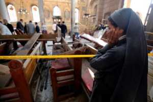 A nun cries as she stands at the scene inside Cairo's Coptic cathedral, following a bombing, in Egypt December 11, 2016. <br/>Reuters/Amr Dalsh