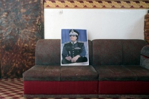 A portrait of Libyan Leader Moammar Gadhafi is set on a couch in a private home in Tripoli, Libya, Thursday March 10, 2011. <br/>AP Images / Jerome Delay