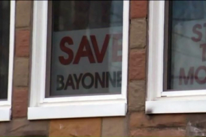 The home of pastor Joseph Basile, minister of Grace Bible Fellowship in Bayonne, N.J., was vandalized after he displayed these signs in his windows and after Bayonne Zoning Board members failed to pass a request from a group called Bayonne Muslims to set up a new worship center. <br/>Screen shot