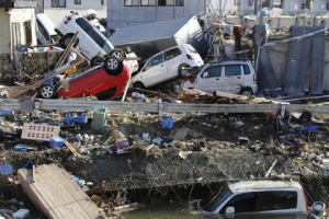 Displaced vehicles are seen at Sendai Port in Sendai, northeastern Japan, Saturday, March 12, 2011, following Friday's 8.9-magnitude quake and the tsunami it spawned hit the country's northeastern coast. <br/>