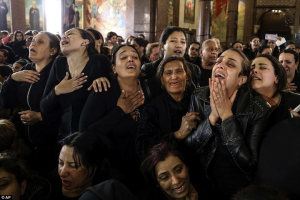 Women weep at a service held to commemorate the victims of bomb attacks on two Coptic churches holding Palm Sunday services in Egypt. <br/>AP Photo