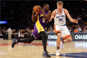 Luol Deng (9) drives against New York Knicks small forward Mindaugas Kuzminskas (91) during the second quarter at Madison Square Garden.  <br/>Reuters/ Brad Penner-USA TODAY Sports