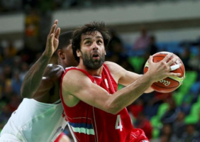 Miloš Teodosić of Serbia drives to the basket during a game against the United States. <br/>Marko Djurica/Reuters
