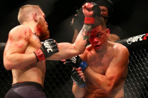 Conor McGregor lands a punch against Nate Diaz during UFC 196. <br/>Reuters