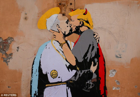 A life-sized mural that shows Pope Francis kissing Donald Trump has appeared on a wall near the Vatican<br />
 <br/>Reuters