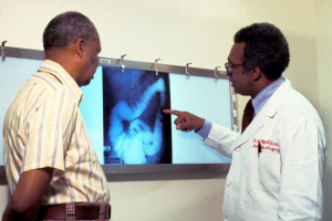 A doctor goes over a patient''s x-ray, screening for colon cancer. There is no single cause of colon cancer. People diagnosed with cancer can follow a way that can help them live longer, and it does not call for traditional methods such as surgery or chemotherapy. It can simply be done by eating right and increasing your time for exercise, doctors noted. <br/>Photo: American Cancer Society / Getty Images