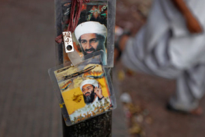 Images of al Qaeda leader Osama bin Laden are displayed for sale at a roadside in Karachi May 4, 2011. <br/>Reuters / Athar Hussain