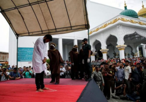 An Indonesian man is publicly caned for having gay sex, in Banda Aceh, Aceh province, Indonesia.  <br/>Reuters/Beawiharta