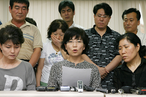 Family members of kidnapped South Koreans in Afghanistan make a statement during a news conference in Seoul asking for the safe return of the hostages. <br/>(Photo: Internet Photo Association)