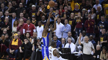 Kevin Durant shoots over Lebron James and makes the three-point shot. The 2017 NBA Finals MVP scored the crucial 14 points in the fourth quarter of Game 3 to help Golden State to 11 straight points, giving the Warriors a  3-0 lead over Cavs on June 7, 2017.  <br/>USA TODAY Sports