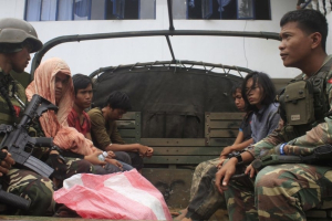 Philippine soldiers guarding members of the extremist Maute Group aboard a military vehicle in Marawi City <br/>Asia News