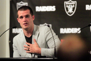Quarterback Derek Carr is the highest paid player in NFL history with a $125 million contract extension with the Oakland Raiders. The first thing he plans to do with the money is pay his tithing. <br/>AP Photo