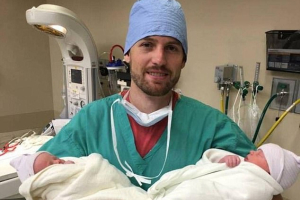 North Carolina Pastor Gentry Eddings holds his newborn twins. <br/>Twitter